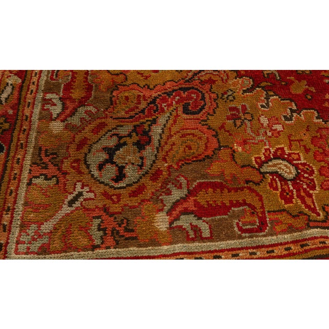 This exquisite Antique Axminster rug, woven in England around 1910, showcases the timeless elegance and craftsmanship...