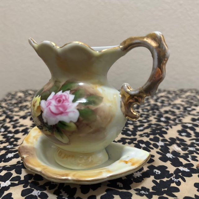 Add a touch of Victorian-inspired elegance to your home with this beautiful vintage porcelain wall pocket. Featuring a...