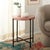 Elevate your living space with the Azula stone top accent table in burnt orange and black. This eye-catching piece...