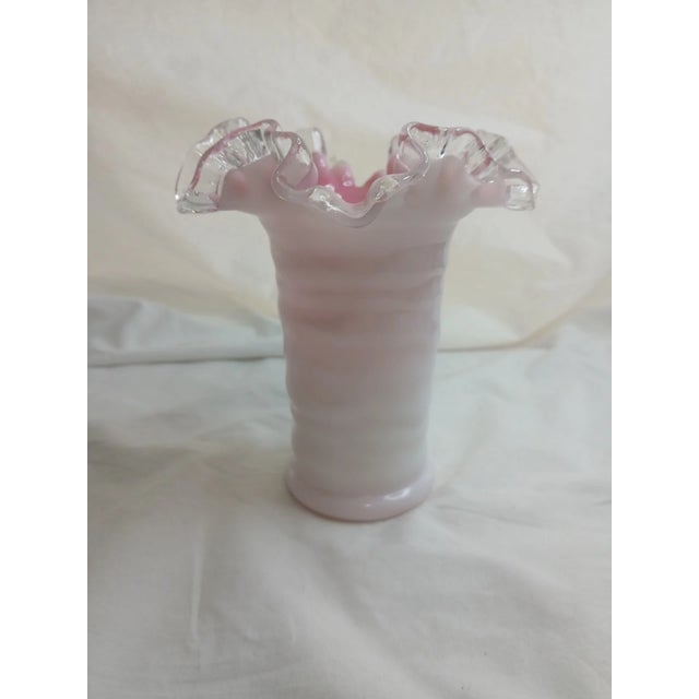 Bring timeless elegance to your home with this beautiful vintage Fenton Pink Crest Milk Glass Vase. Expertly handcrafted...