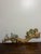 Charming vintage wall sculpture featuring two colorful birds perched on a beautifully sculpted tree branch. The branch is...