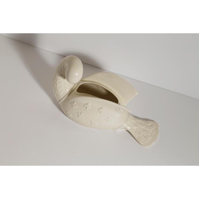 A sculptural dove vase designed by Kathi Urbach for Beswick, England, during the 1950s. Executed in glazed ceramic, the...