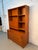 A mid-century modern Danish stackable bookcase crafted in warm teak by Domino Møbler of Denmark. This versatile piece...