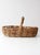 A beautifully weathered vintage gathering basket with an elongated oval form, high arched handle, and wonderfully...