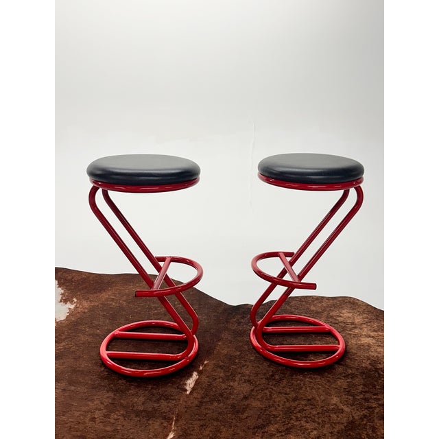 Pair of sculptural bar stools with Red Metal Cantilevered frames & Black Leatherette Seats. Great Modern 1980s New York...