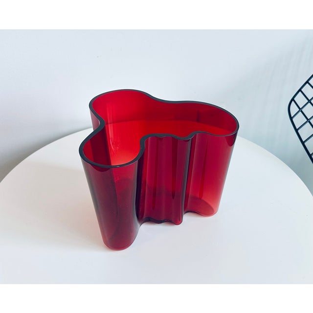 Iconic large Alvar Aalto Savoy Vase Model. 3030 in ruby red, Iittala Alvar Aalto entered and won a competition held at the...