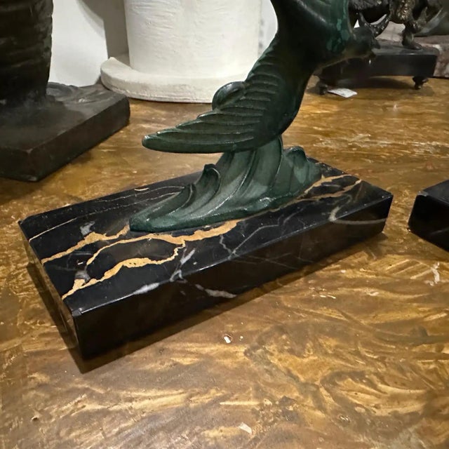 This is a pair of 1930s Art Deco French bookends. Each bookend features a sculptural bird design made of metal, which...