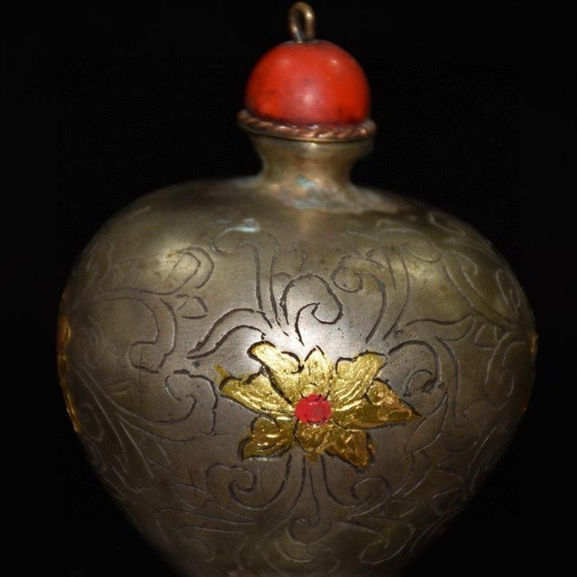 Add a touch of historical elegance to your collection with this exquisite antique snuff bottle. Crafted from silver with a...