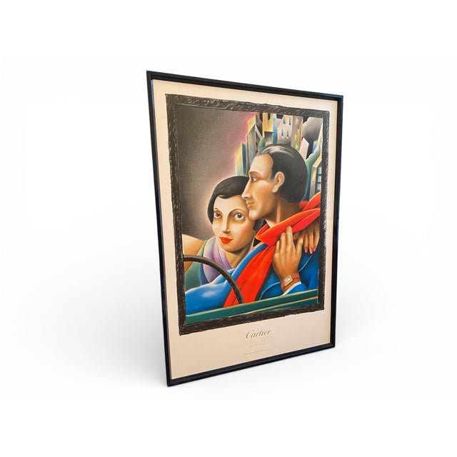 Original lithographic poster produced for cartier joailliers in 1985. the composition depicts an elegant couple seated in...