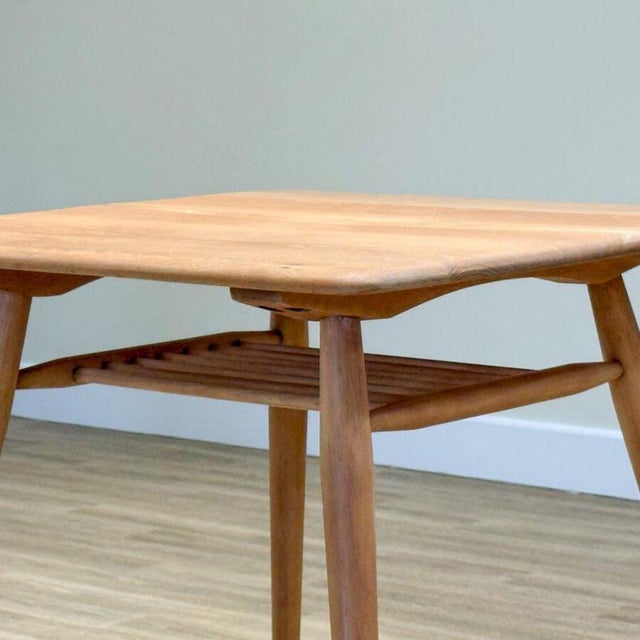 A charming and unusual mid-century Ercol dining set, designed by Lucian Ercolani in the 1960s and beautifully handcrafted...