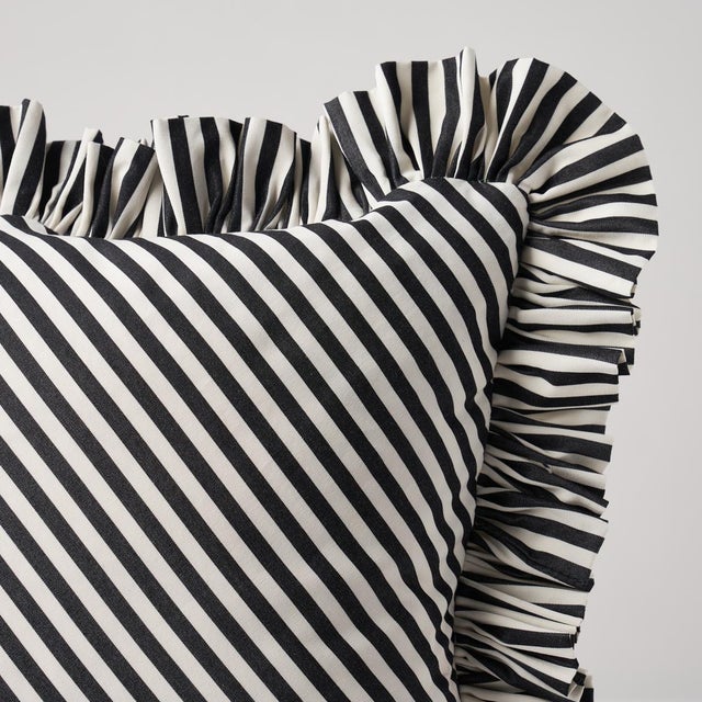 This pillow features Brigitte Stripe with a fringe finish. The perfect thin stripe, not too casual and not too dressy....