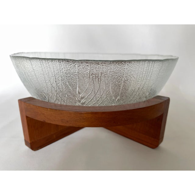 1960's Danish Modern opaque pressed glass bowl with curved teak wood stand. Glass bowl measures 10" diameter x 4.25"...