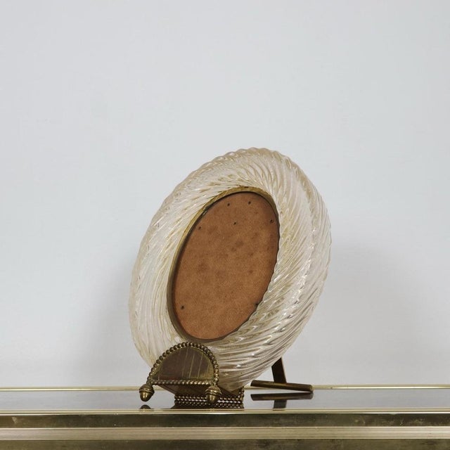 Refined photo frame attributable to Barovier & Toso, a historic Venetian glassworks that is a symbol of excellence in...
