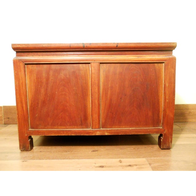 This Chinese treasure trunk is handcrafted in the elegant Ming “waist” style, featuring a narrower carved waist connecting...