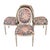 Set of four French style dining chairs with a distressed painted finish and vibrant floral upholstery. The frames feature...