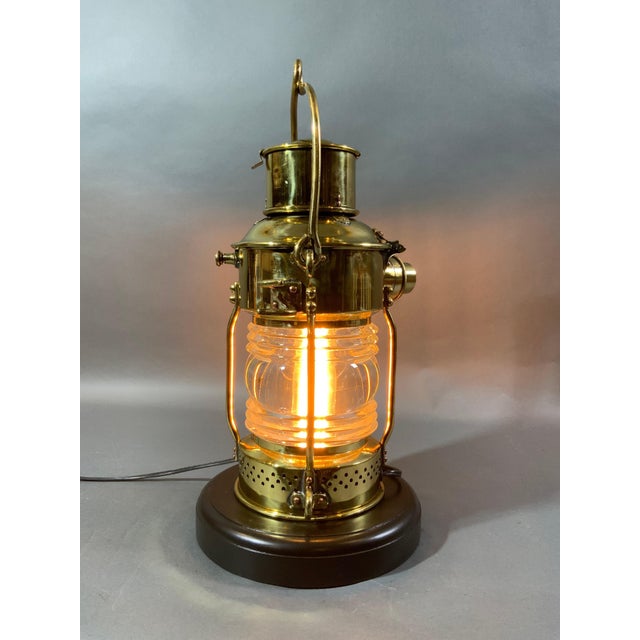 Antique solid brass ships anchor lantern with Fresnel glass lens, hinged top, carry handle, etc. with makers plate from...