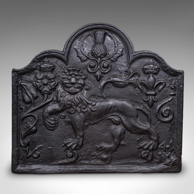 This is an antique decorative fire back. An English, cast iron relief fireplace reflector with Carolean taste, dating to...