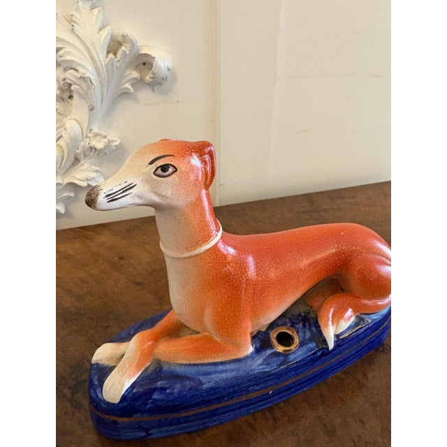 Antique pair of Staffordshire Greyhound inkwells on raised blue cobalt bases with gilt decoration. In perfect original...