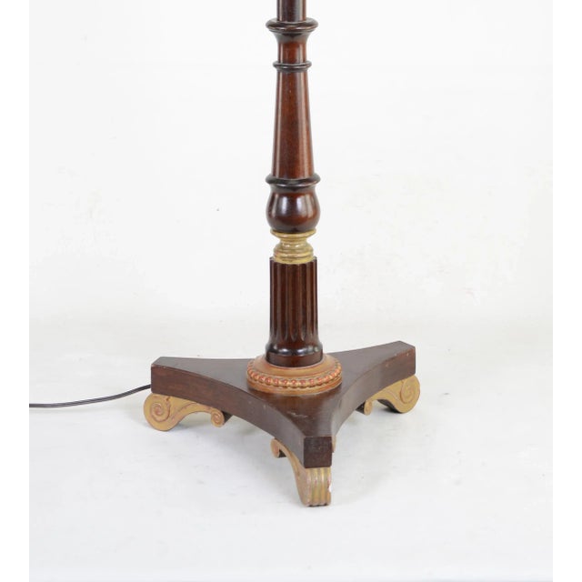 Floor lamp painted brown stain with gold color on embellishments. Tripod feet, each a carved wooden scroll. size：13" * 13"...