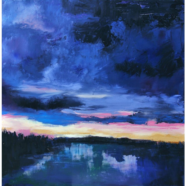 The painting captures a serene lakeside scene at dusk, where deep blues and purples dominate the sky, creating a dramatic...