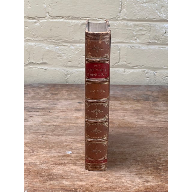 An extraordinary piece of Victorian history, this beautifully bound 1886 antique edition of *The Queen’s Empire; or, Ind...