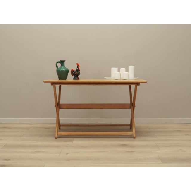 The coffee table was made in the 1970s, Danish production. The legs are made of ash wood. The table top is covered with...