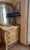 Octagonal cerused-oak mirror with a thick chunky stacked molded frame and beveled glass. The cerused-oak finish has a soft...