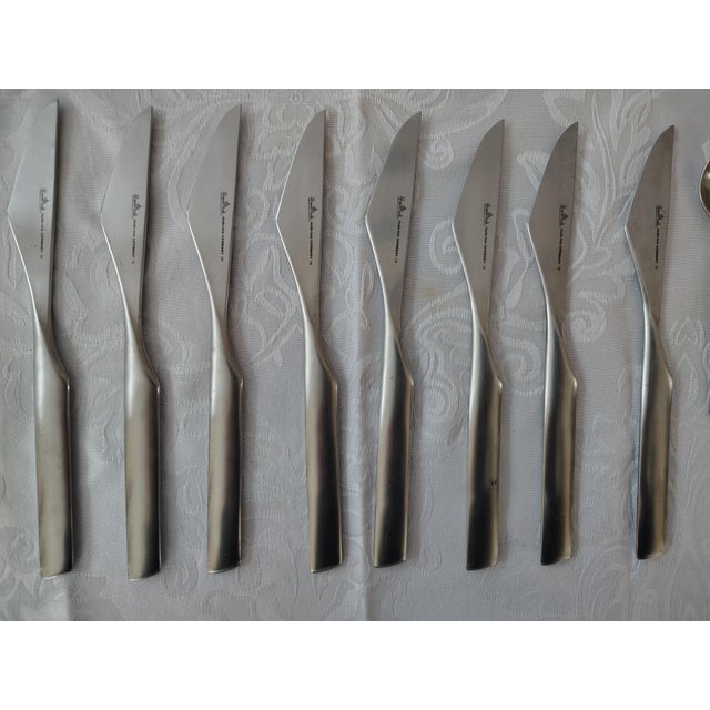 Composition "S" 40 piece stainless steel flatware designed mid century by Finnish artist Tapio Wirkkala for Rosenthal. A...
