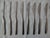 Composition "S" 40 piece stainless steel flatware designed mid century by Finnish artist Tapio Wirkkala for Rosenthal. A...