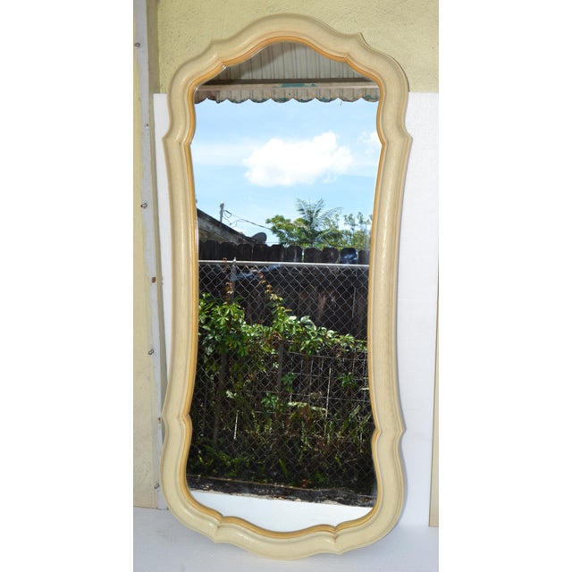 1970s John Widdicomb Attributed rectangular wall mirror with an ornate, curved Resin frame. The frame features a light...