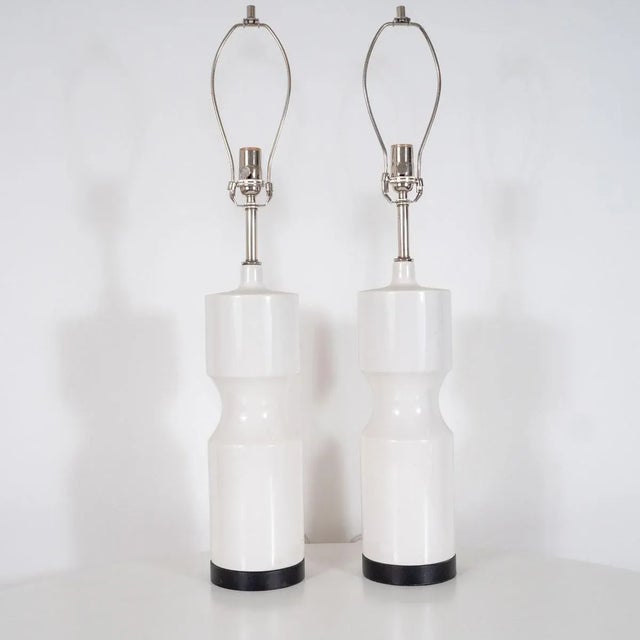 Pair of "turned" ceramic table lamps Origin: United States Circa: 1980s Dimensions: 31" high , 5.50" diameter Materials:...
