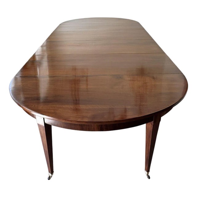 Large Scale 19th Century French Restauration Walnut Extension Dining Table With Five Leaves and Additional Support Legs For Sale