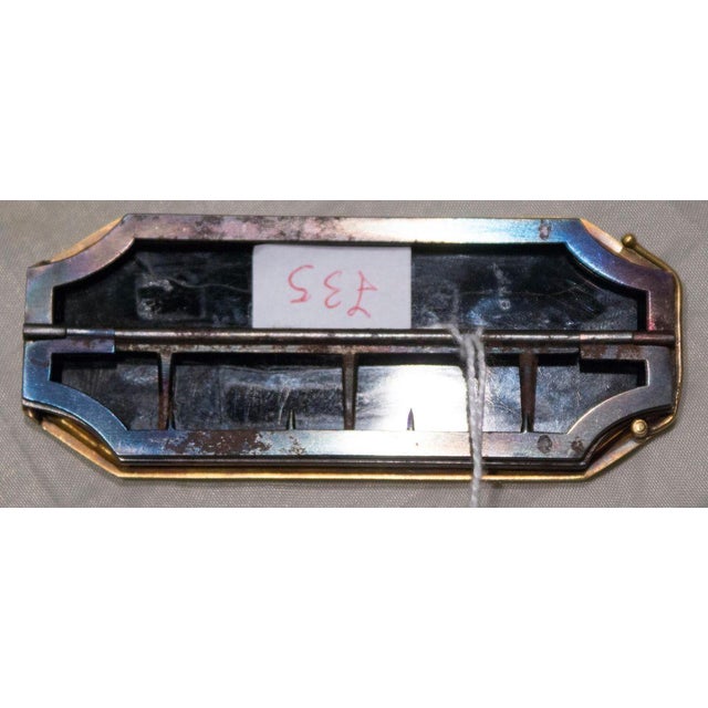 Slate finely decorated with micromosaic. Designed as a buckle. Rome, 19th century.