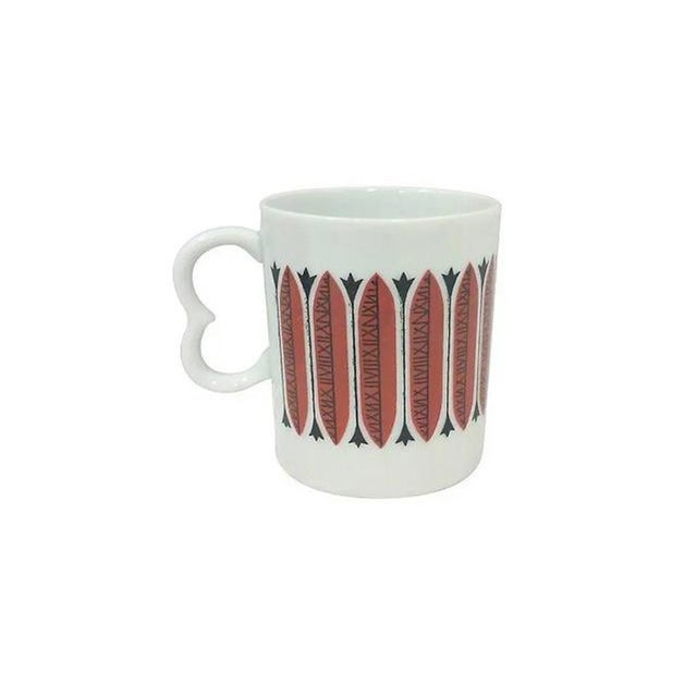 Mid-Century porcelain red mugs with a modernist design in brick red and black against white porcelain background. All of...