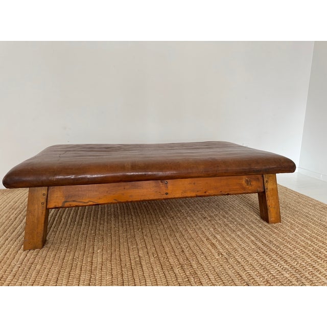 Vintage European gym bench, which can be repurposed as a unique large scale coffee table or oversized ottoman. Often...