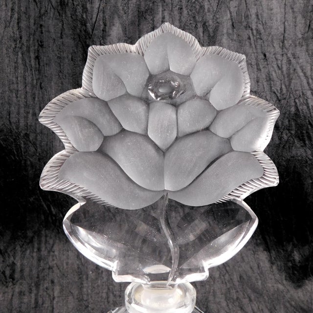 This is an Irice brand large crystal perfume bottle with a large cut glass flower shaped stopper. The bottle has two...