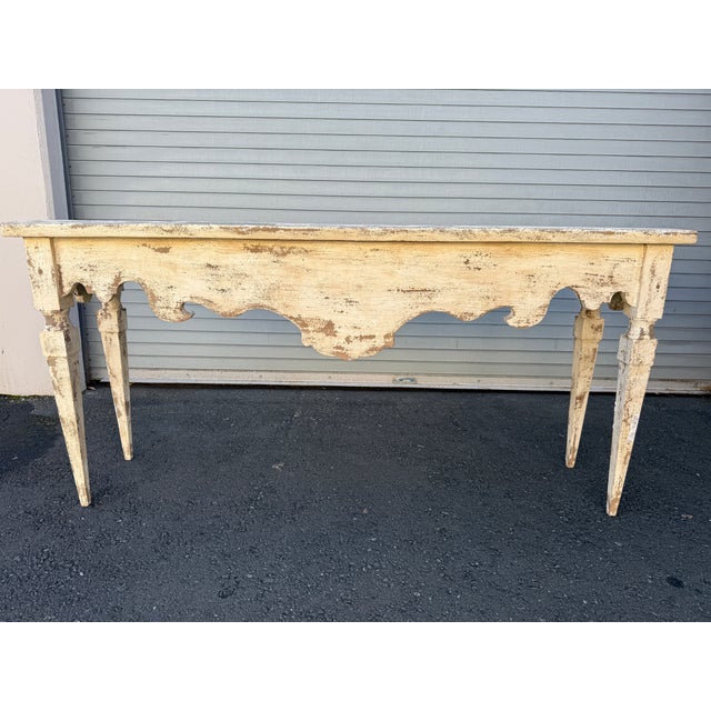 This beautiful carved Italian table is truly unique. With a striking patina from years of use, this console table is...
