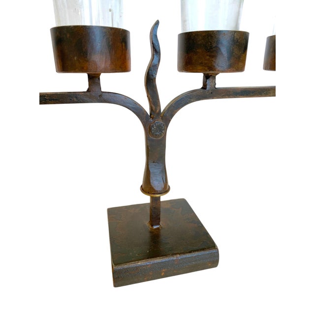 Stunning Jan Barboglio hand forged iron candelabra with rustic patina. Signed on both sides. Includes removable glass...