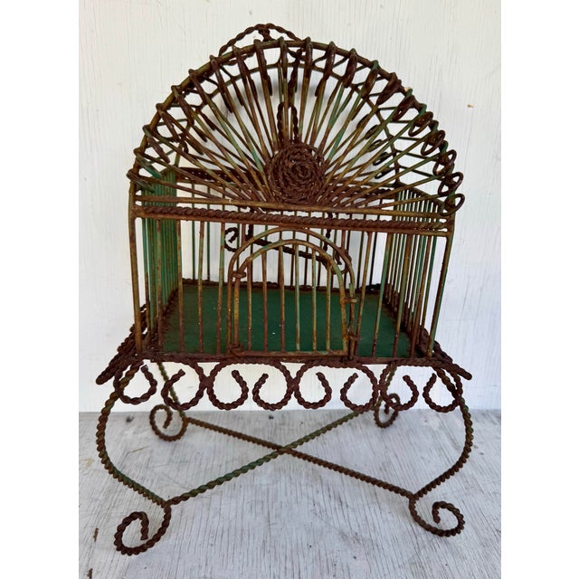 Add a touch of whimsy and charm to your space with this super cute vintage hanging bird cage. Crafted from iron, this...