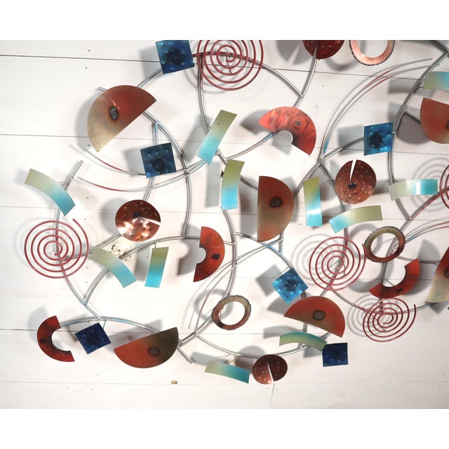 Early 2000's circular ring wall hanging sculpture made in the style of Curtis Jere for Artisan House. It wouldn't surprise...