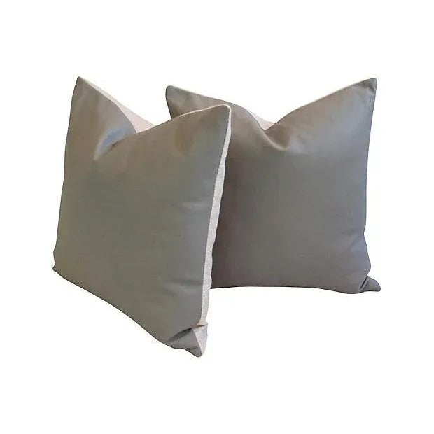 Pair of custom-made pillows in pale gray Italian Spinneybeck pebble grain leather. The leather comes from hides obtained...