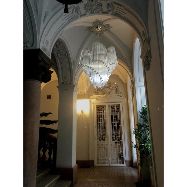 A magnificent pair of Murano glass chandeliers, spiral shape, very elegant, 114 quadriedri on gold metal frame. This large...