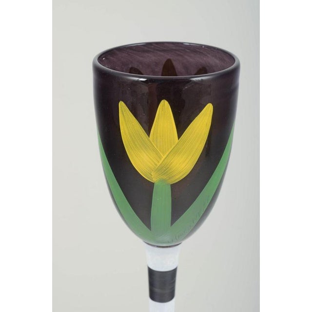 Ulrica Hydman Vallien for Kosta Boda Wine glass, 1990s. Tall decorative art glass with a hand-painted floral motif in...