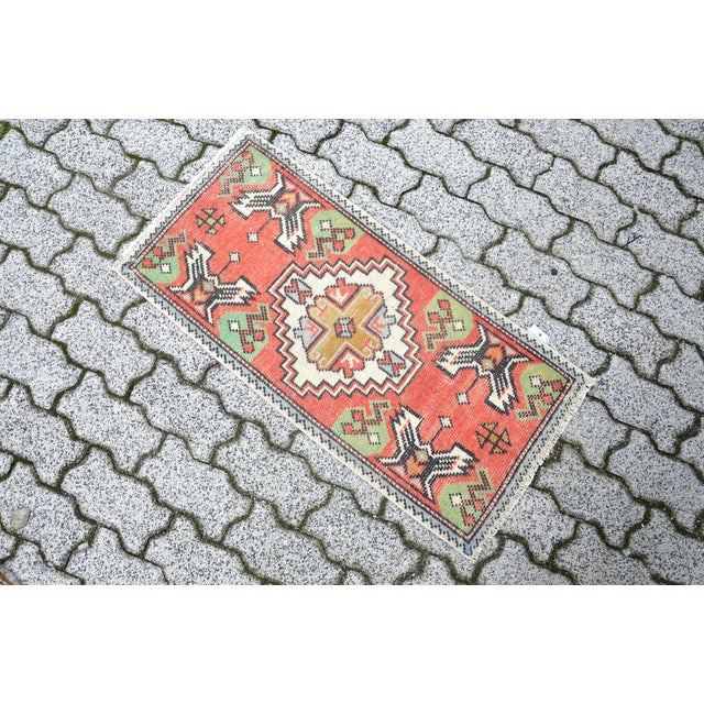 This is a vintage Turkish Oushak rug from the 1960s. The piece was hand-knotted.