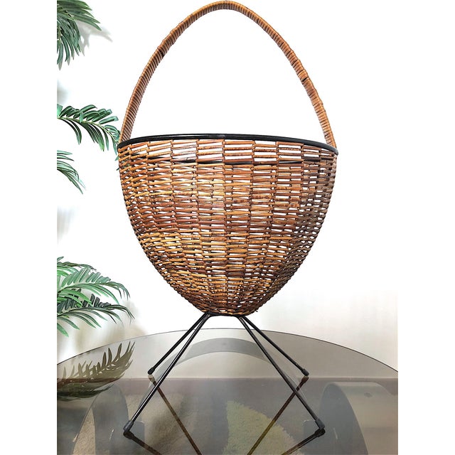 One-of-a-kind vintage magazine rack from the 1960s. This elegant magazine rack dating back to the 1960s is perfect for...