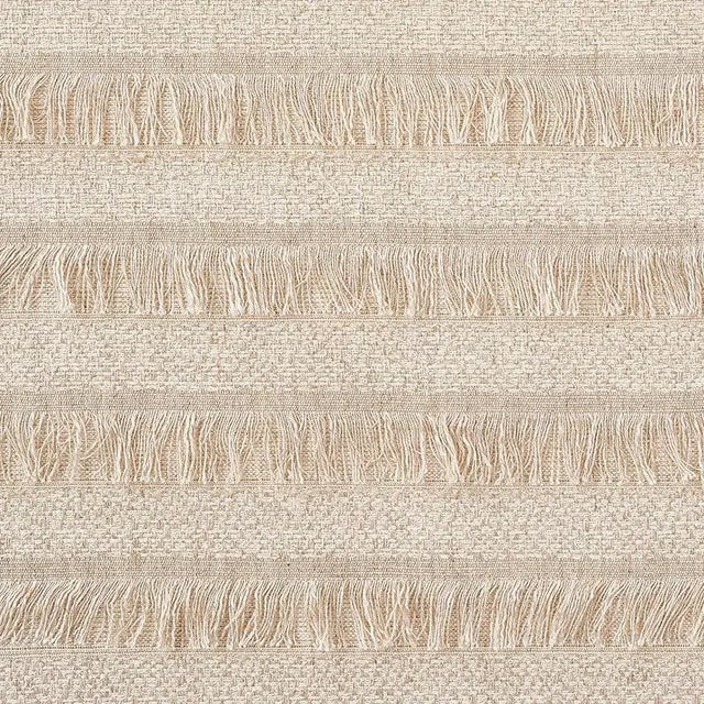 A horizontal fringed stripe, Acadia derives from a textile in our archives from the 1970s. Beautifully woven with silk...
