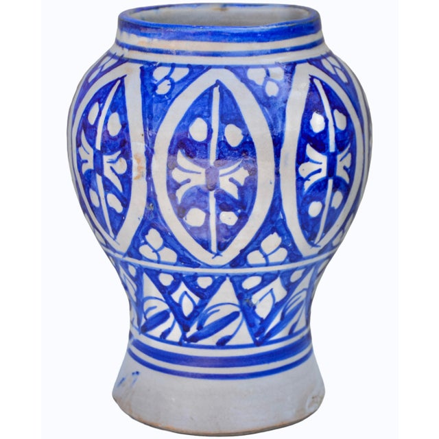 Impressive one-of-a-kind antique Moroccan ceramic vase meticulously handcrafted and glazed in an ornate curved silhouette....