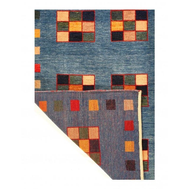 Gabbeh rugs are made by the nomadic Qashqai tribes of southern Far Region. They are rough cut and long piled rugs of rich...