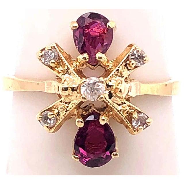 14 Karat Yellow Gold Free Form Ruby And Diamond Ring Size 6.25 2.54 grams total weight.