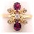 14 Karat Yellow Gold Free Form Ruby And Diamond Ring Size 6.25 2.54 grams total weight.